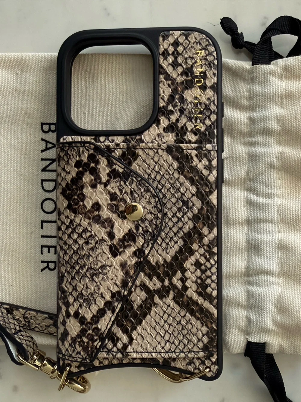 Bandolier Snake-Print Crossbody Phone Case in Black and Tan with Gold Hardware